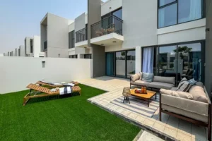 Modern townhouse patio with outdoor seating and lawn